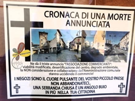 SAN BENIGNO CANAVESE - Manifestini funebri per il commercio locale: negozianti sul piede di guerra